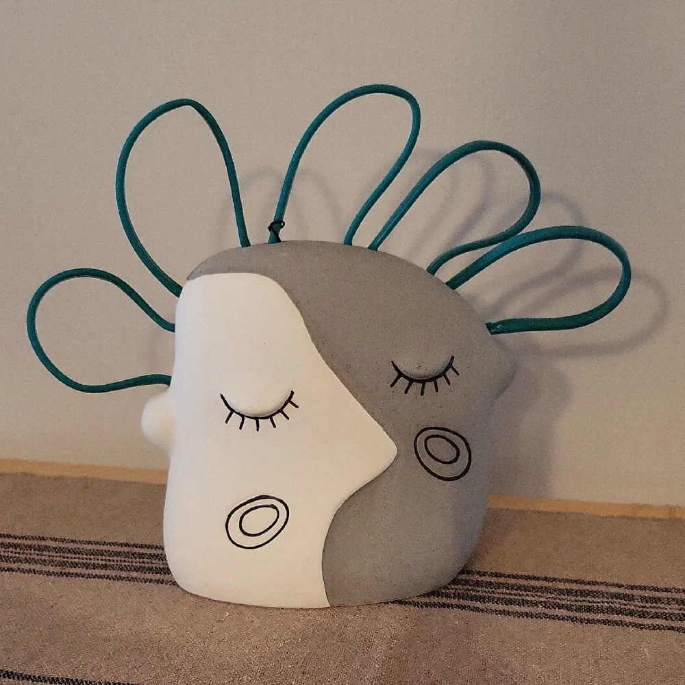 Abstract Face Aquarium Decor with Teal Accents